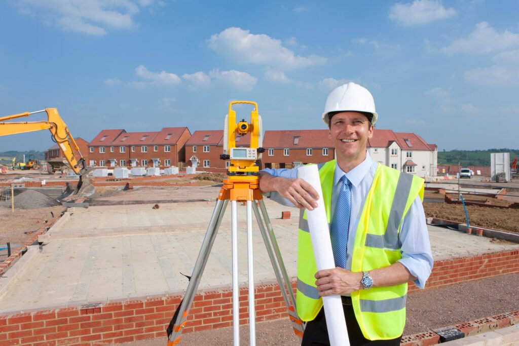 Scoping surveyor standing in a PM+ surveyed housing development